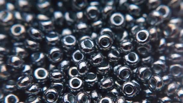 Demonstration of black jewelry beads — Stock Video