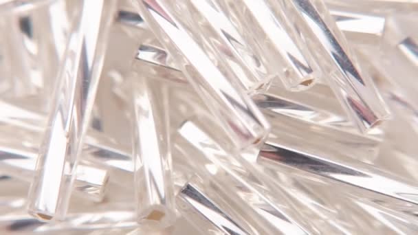 Crystals with silver inside on a white plate — Stockvideo