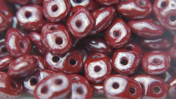 Brown beads. Jewelry beads with two holes. — Stock Video