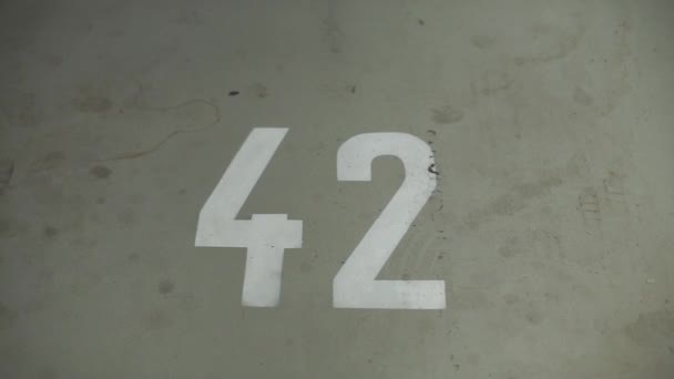 Number 42 painted on the garage floor — Stock Video