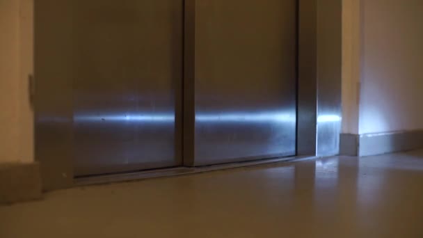 Man on a gyroscooter drives into an elevator — Stock Video