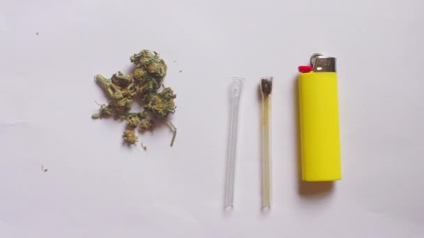 Smoking cannabis, devices, lighter on a white background — Stock Video