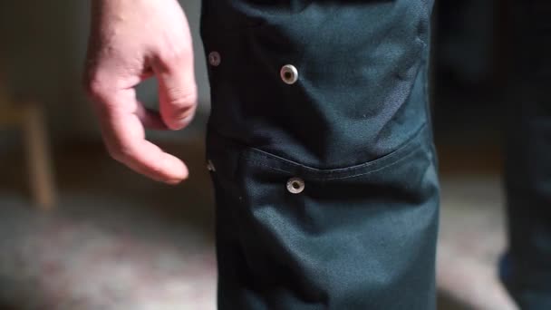 Close-up, black pants with rivets — Stock Video