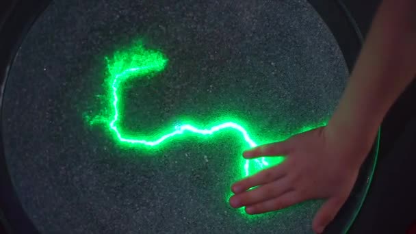 Close-up of a hand on a plasma disk. — Stock Video