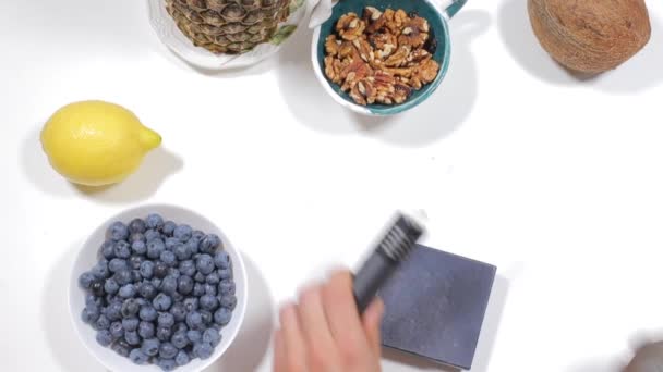 Man puts a vaporizer for cannabis on the table — Stock Video