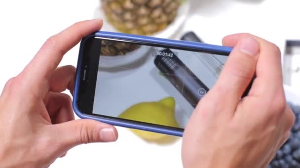 Smartphone shoots video, blueberries, marijuana, vaporizer, announcement — Stock Video
