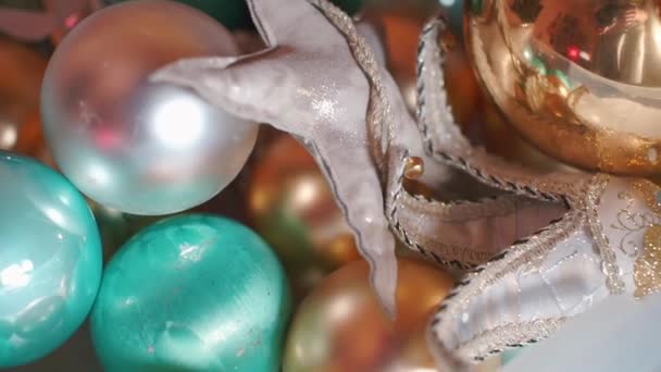 Closeup of christmas toys piled in a box in a store. — Stock Video