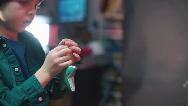 The boy holds in his hands a toy star. — Stock Video