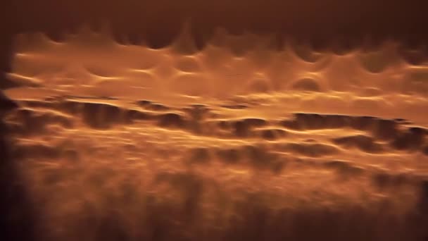 Moto di una texture fatta di brillantini di luce arancione . — Video Stock