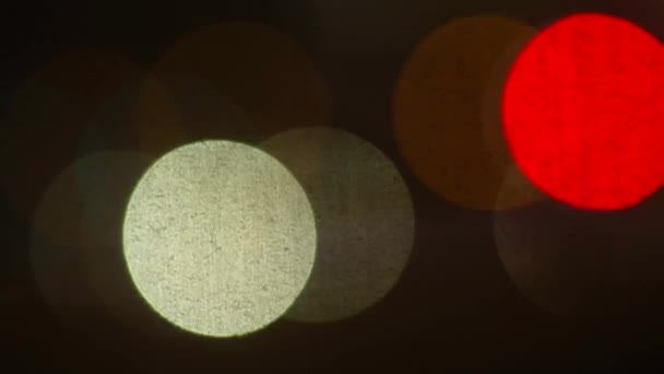 Κοντινό πλάνο ενός φόντου φτιαγμένο από πολύχρωμους λαμπτήρες σε κίνηση. — Αρχείο Βίντεο