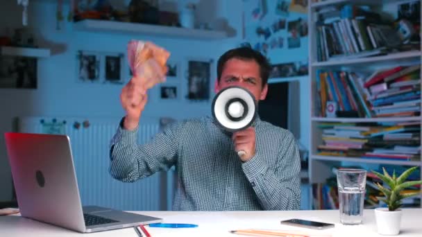 Aggressive businessman shouting into a megaphone in office. — Stock Video