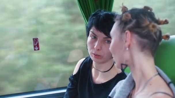 Two women ride a public transport bus. — 비디오