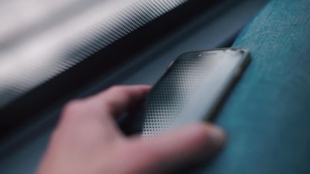 Close-up of a smartphone in the hands of a man. — Stock Video