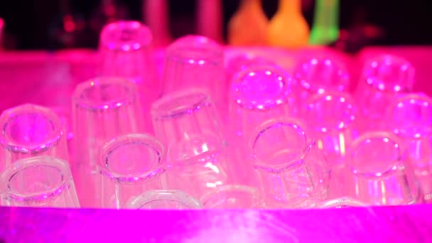 Close-up of folded glasses in a bar at a nightclub party. — Stock Video