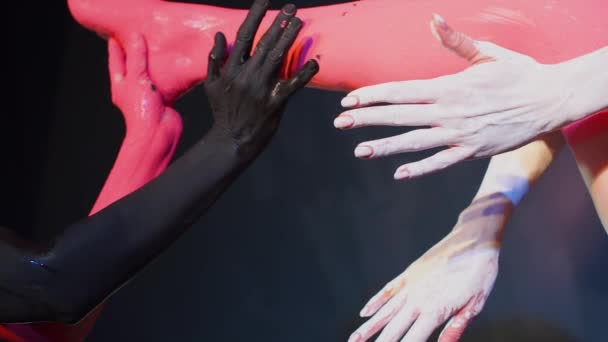 A composition made of the arms and legs of feminists women. — Stock Video