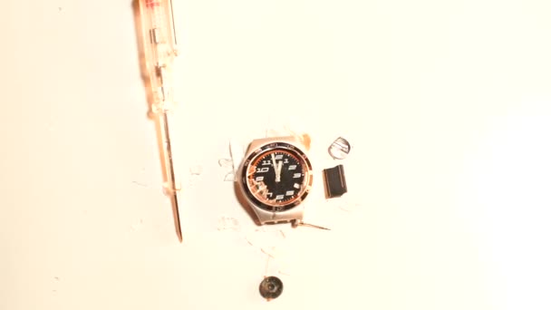 Close-up de um relojoeiro sobre um fundo branco — Vídeo de Stock