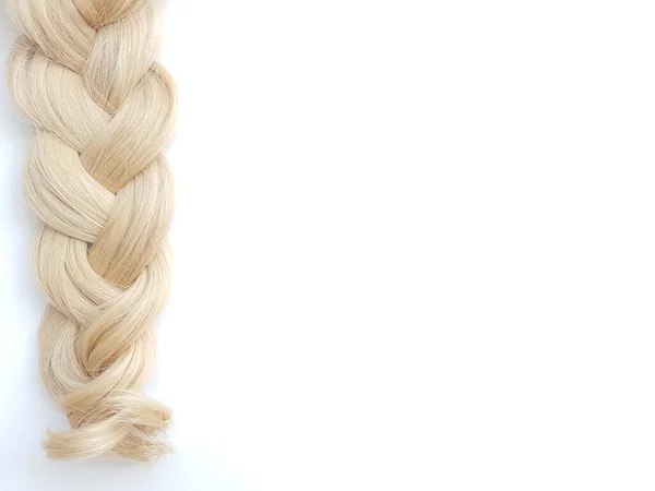 Curls of natural blonde hair on a white background. — Stock Photo, Image