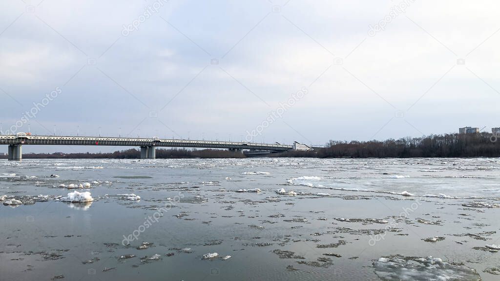 The movement of ice on the river in the spring after a cold winter in Siberia.