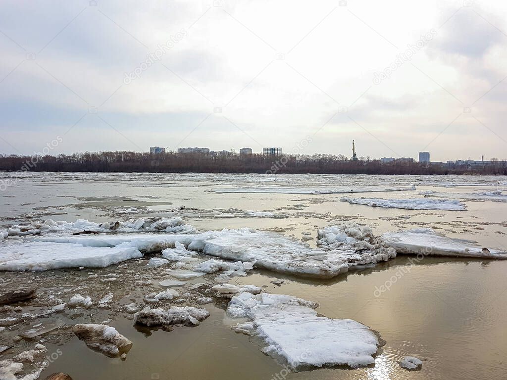 The movement of ice on the river in the spring after a cold winter in Siberia.