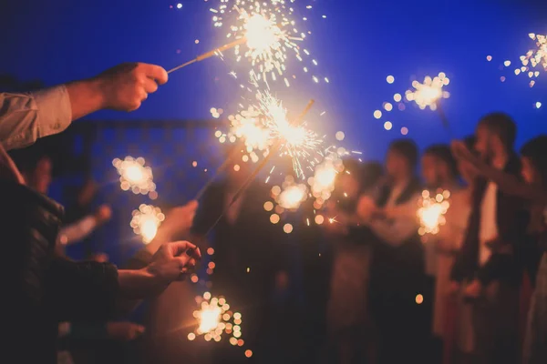 Crowd Young Happy People Sparklers Hands Birthday Celebration — Stock Photo, Image