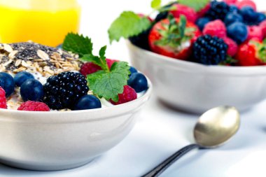 Bowl of berries with orange juice