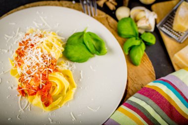 Fresh pasta with tomato sauce.