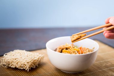 Dried Chinese noodles with meat in the dish