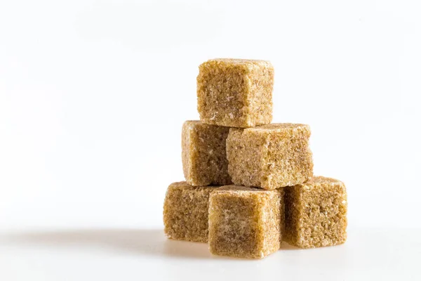 Cane sugar cubes on a white background — Stock Photo, Image