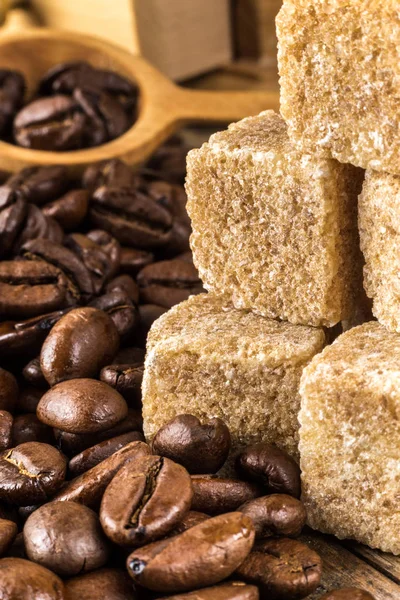 Coffee beans with cane sugar — Stock Photo, Image