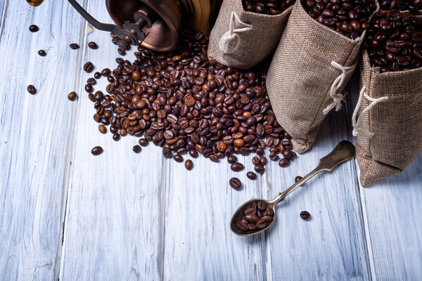 Jute bags with coffee beans and grinder