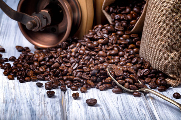 Jute bags with coffee beans and grinder
