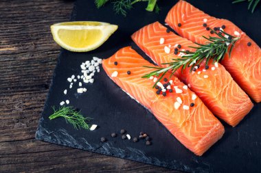 Salmon filet sliced on three parts with lime
