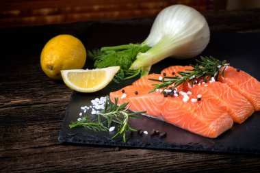 Salmon filet sliced on three parts with lime