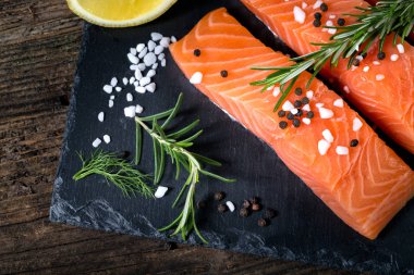 Salmon filet sliced on three parts with lime