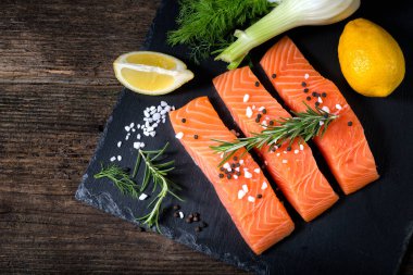 Salmon filet sliced on three parts with lime
