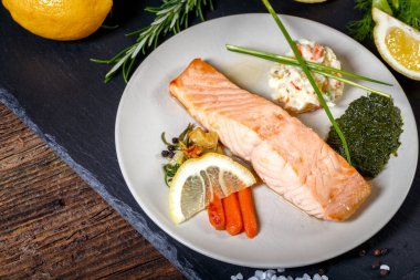 grilled Salmon with lemon, herbs and pesto