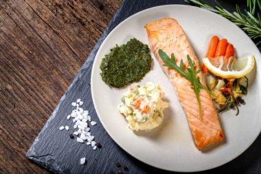 grilled Salmon with lemon, herbs and pesto