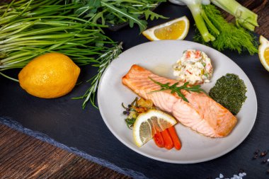 grilled Salmon with lemon, herbs and pesto