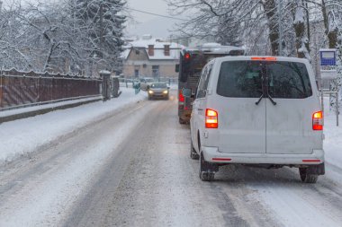 Traffic jam in the middle of winter. Snow calamity.