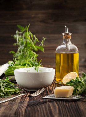 Lettuce and a bottle of olive oil