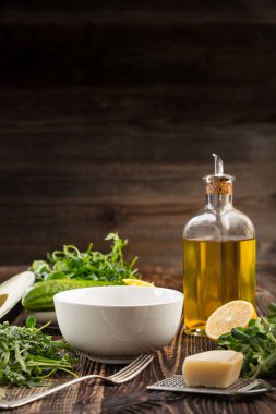 Lettuce and a bottle of olive oil