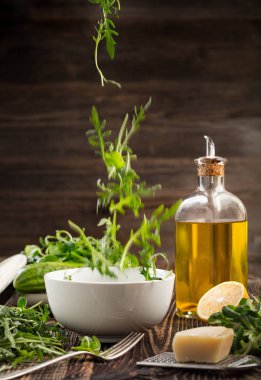 Lettuce and a bottle of olive oil
