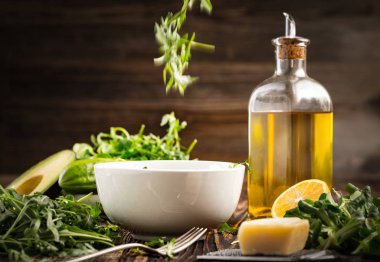 Lettuce and a bottle of olive oil