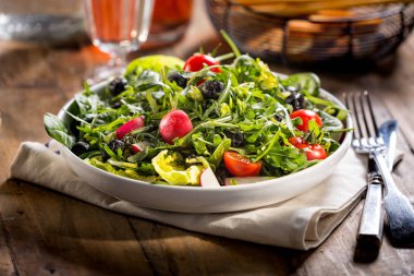 Green salad served on the plate.