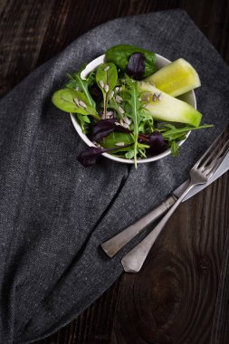 Spring salad with cucumber and arugula.