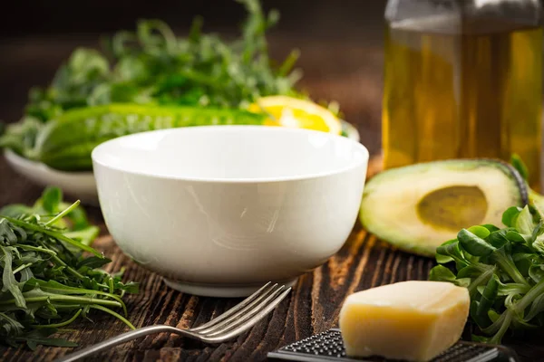 Lettuce and a bottle of olive oil