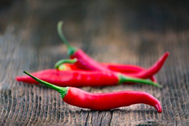 Fresh red chilli pepper on a wooden table