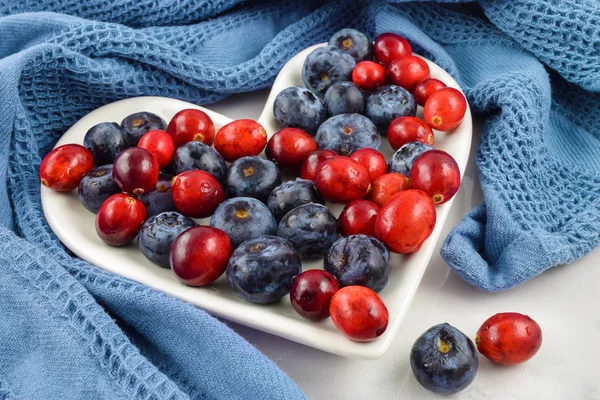 Inviting Heart Healthy Concept of Cranberries and Blueberries