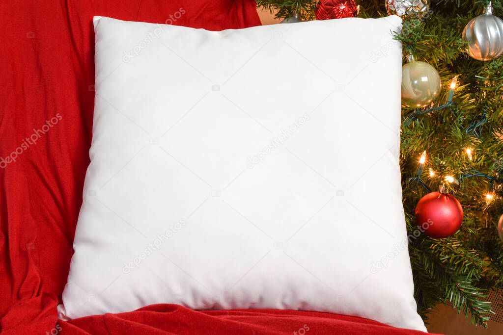 White Square PIllow Mockup Resting on Red Blanket with Lit Up Ch