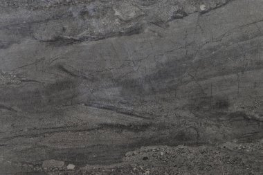 Yukardan alınmış yıpranmış gri mermer bir arka plan. 